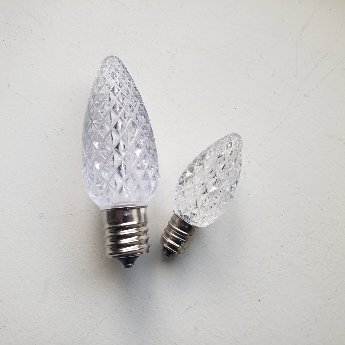 C7 and C9 LED Christmas light bulbs shown side by side for size comparison