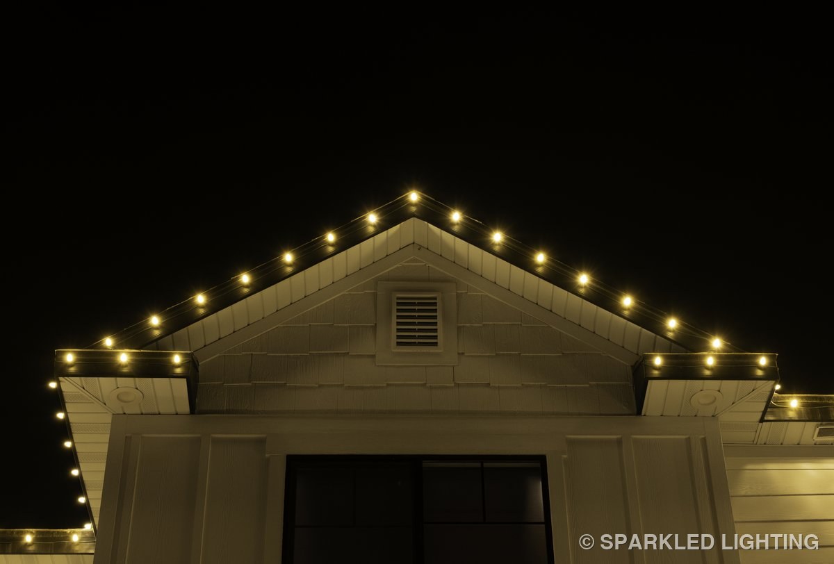 Close-up of seasonal Christmas lights on a steep Kaysville Utah peak in warm white