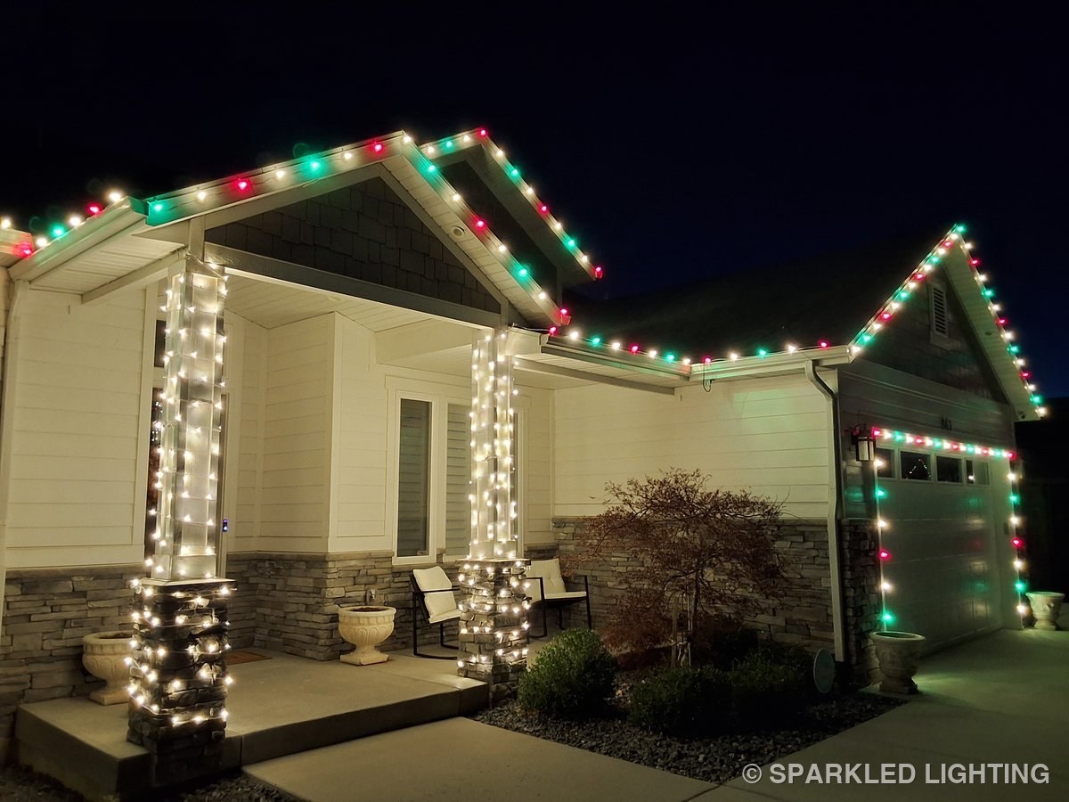 Wrapped porch columns in red, green and warm white at the same North Ogden Utah home