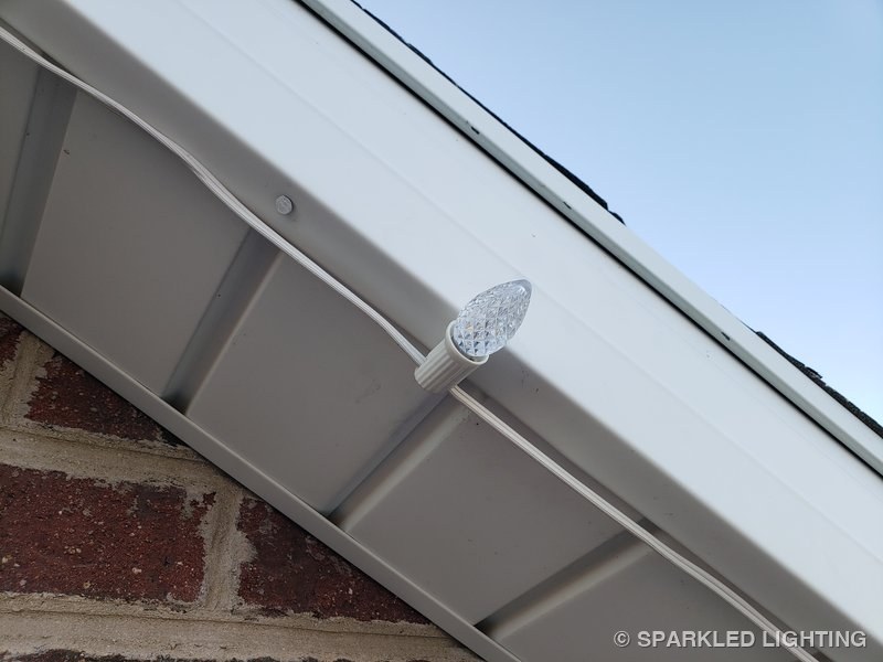 Christmas lights installed on soffit close-up on a Utah home