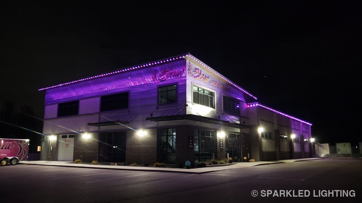 Shaw Dance Studio in Clinton Utah washed in purple permanent LED lights at night