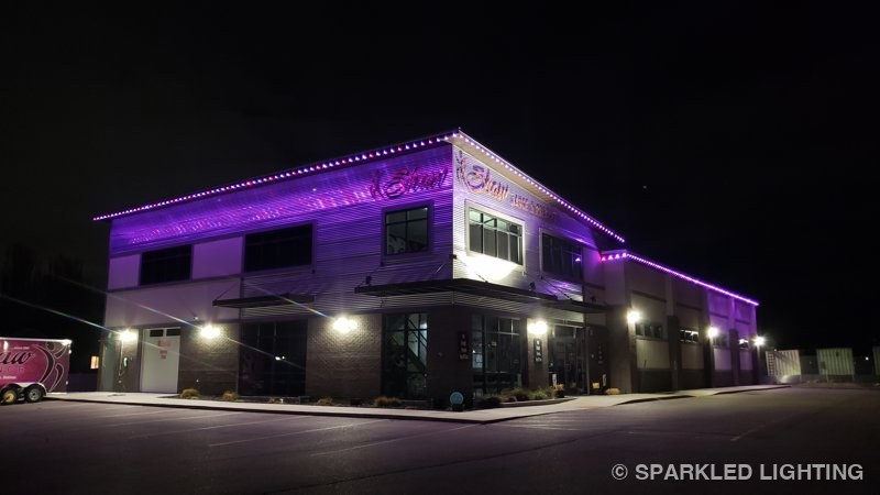 Shaw Dance Studio in Clinton Utah washed in purple permanent LED lights at night