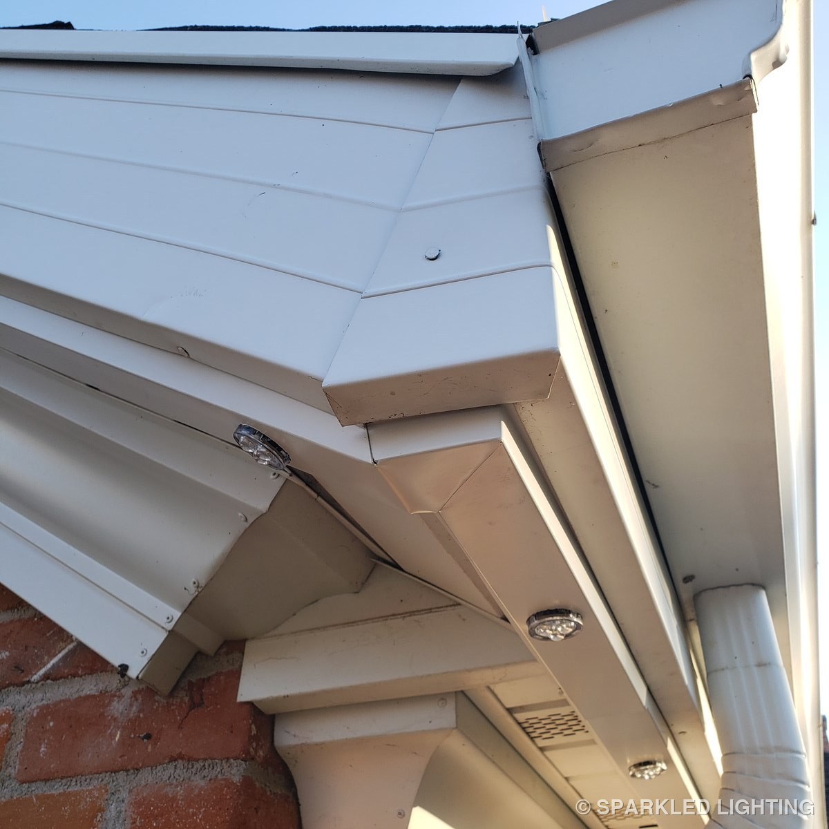 Permanent LED lights close-up showing clean corner and rake channel installation