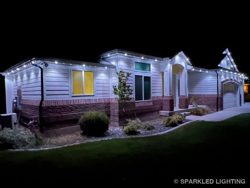 Permanent LED lights installed on a single story house on a Farr West Utah home in pure white