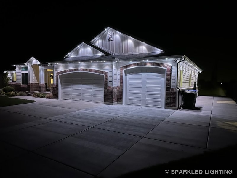 Permanent LED lights installed on a single story house on a Farr West Utah home in pure white