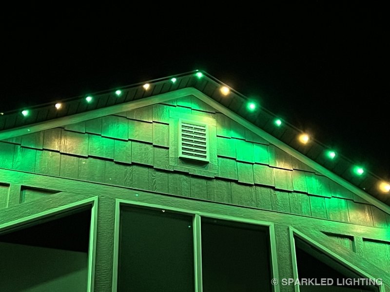 Permanent LED lights installed on gable close-up on a Hooper Utah home in green