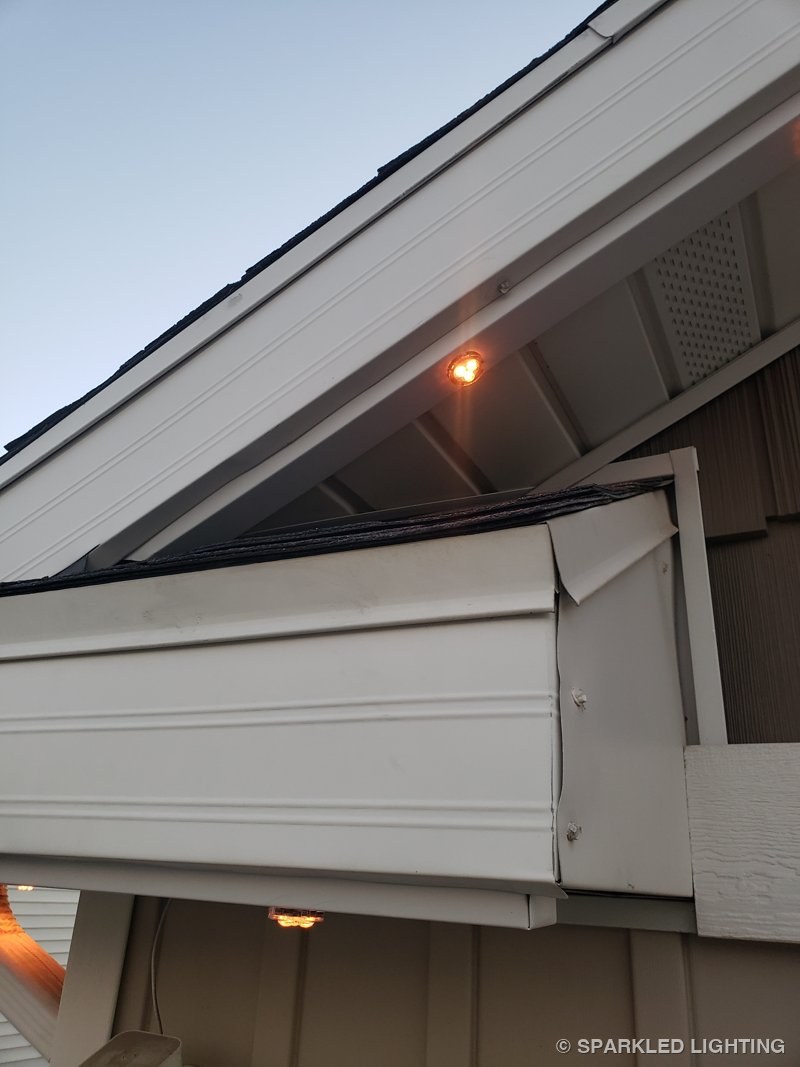 Permanent LED lights installation showing a roofline jump finished, with the jumper cable concealed inside the aluminum channel