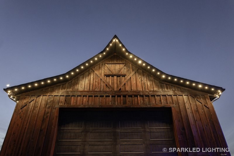 Permanent LED lights installed on a barn on a Kaysville Utah home in warm white
