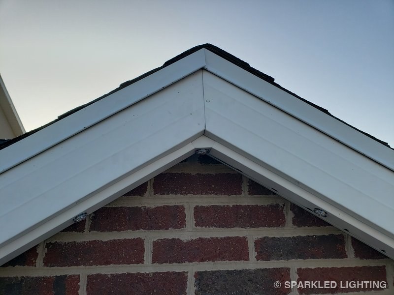 Permanent LED lights installed on peak close-up on a Utah home