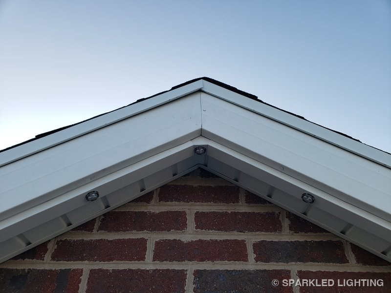 Permanent LED lights installed on peak close-up on a Utah home