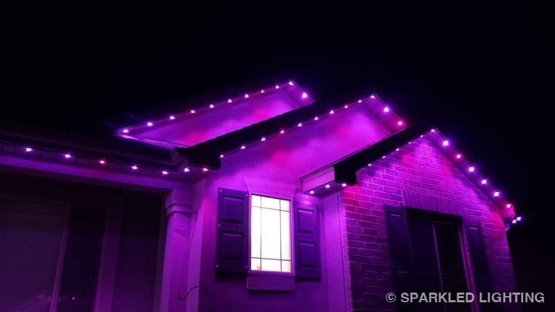Permanent LED lights installed on gable close-up on a Syracuse Utah home in pink