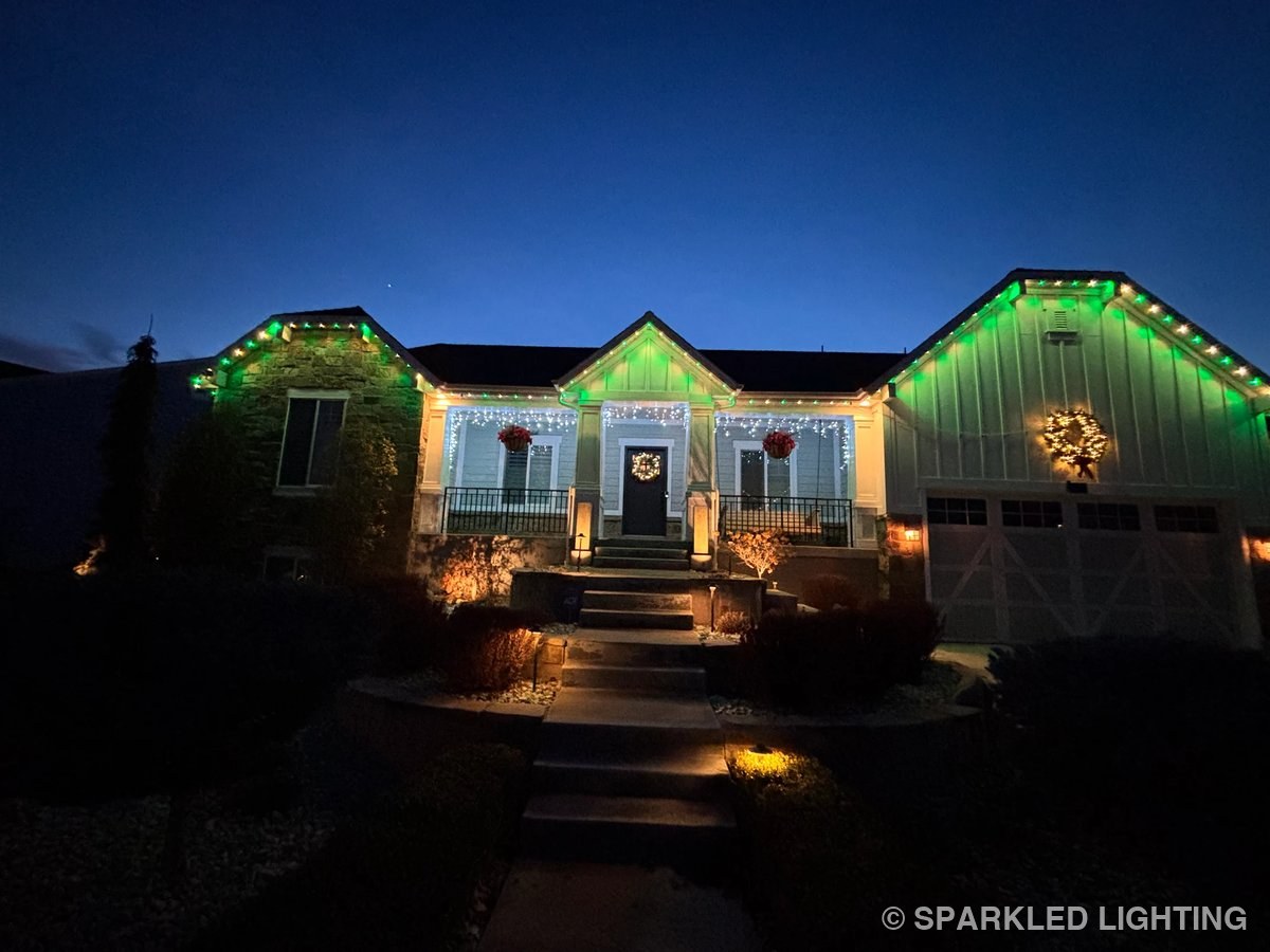 SmartClip LED lighting on a single story Syracuse Utah home in green and warm white