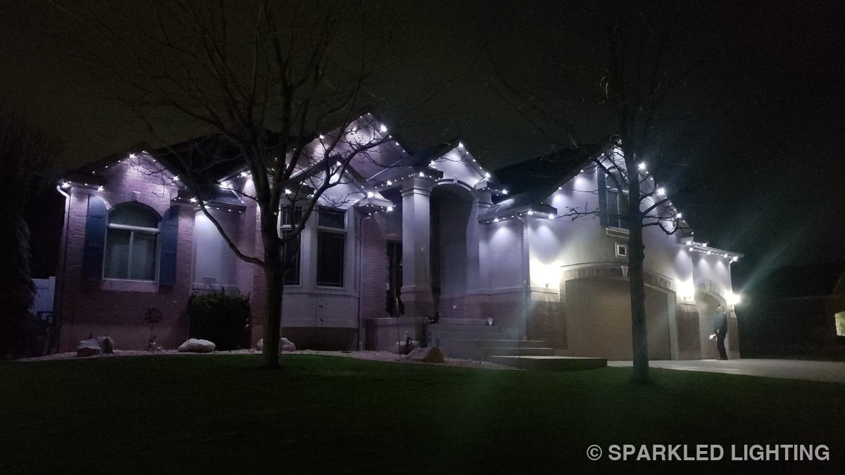 Permanent LED lights installed on a single story house on a Syracuse Utah home in pure white