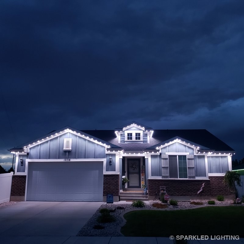 Permanent LED lights installed on a single story house on a Syracuse Utah home in pure white