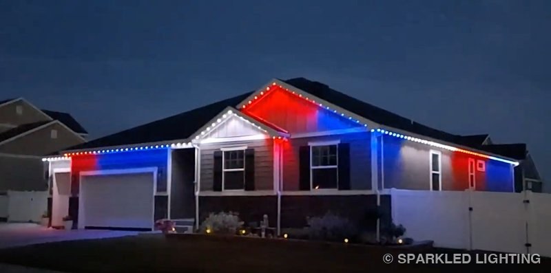 Permanent LED lights installed on a single story house on a Syracuse Utah home in red, white and blue