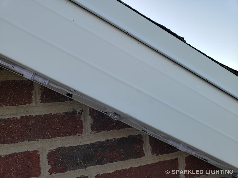 Removable RGBW lights installed on fascia close-up on a Utah home