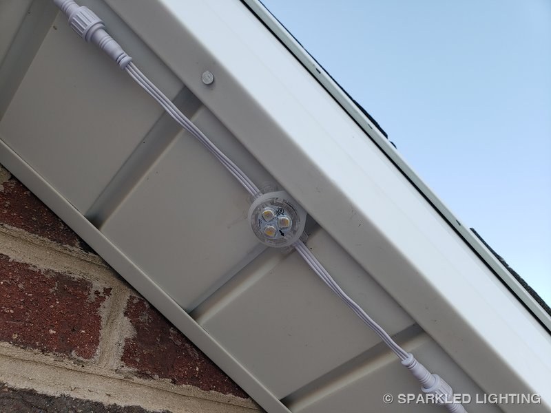 Removable RGBW lights installed on a soffit on a Utah home