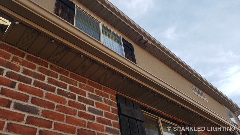 SmartClip LED bulbs along the eave of a brick West Point Utah home in daylight